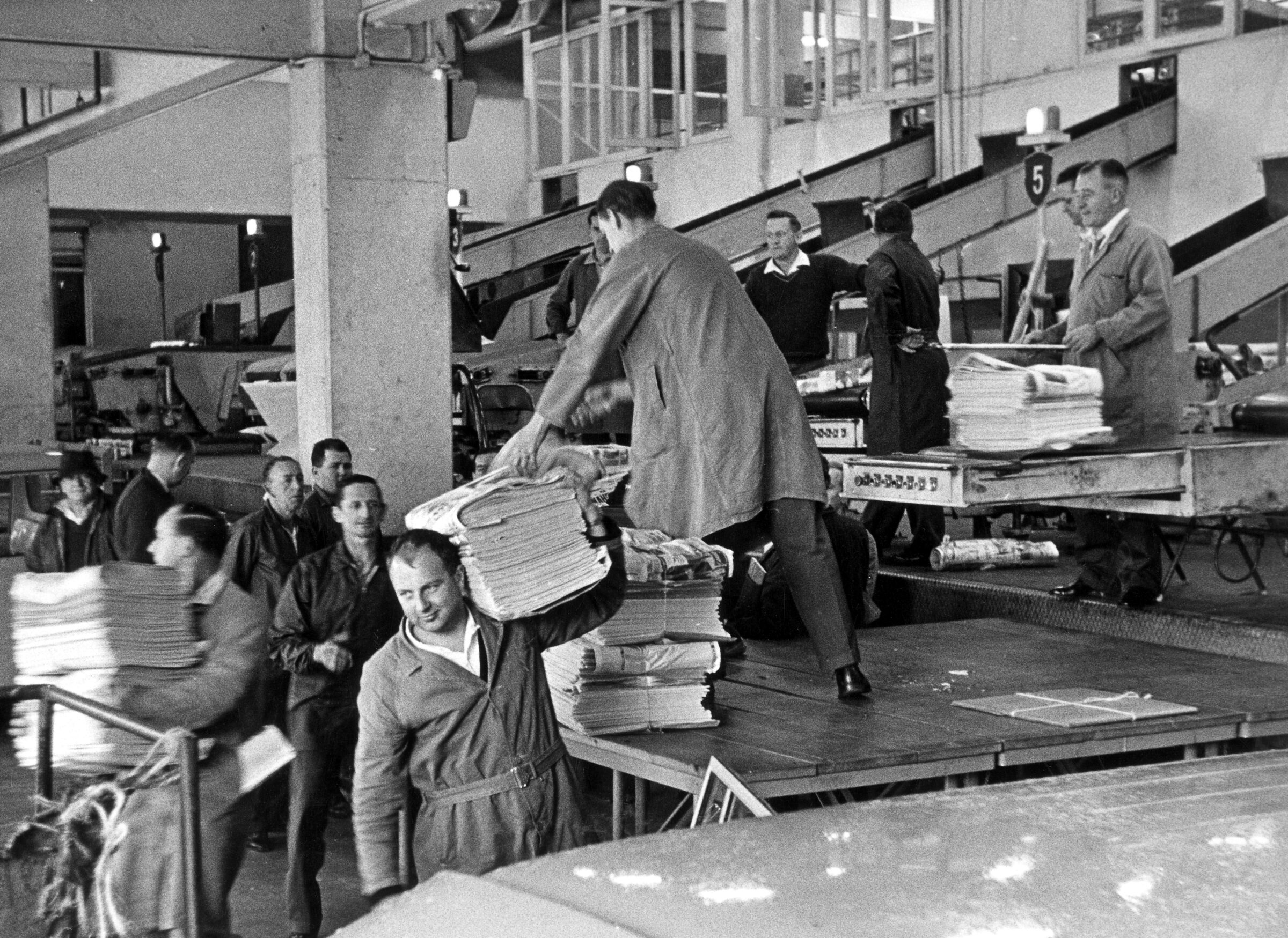 Newspapers are loaded from the presses at the Sydney Morning Herald Broadway building in Ultimo, 1966